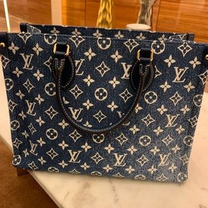 New denim on the go tote. New with tags box and dust bag.